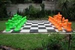 lime green and orange chess set